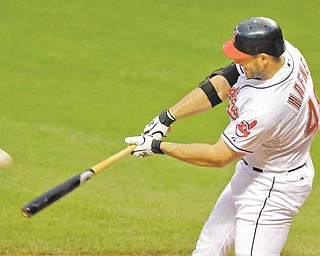 Cleveland Indians' Travis Hafner hits a three-run home run off Colorado Rockies starting pitcher Juan Nicasio in the first inning of a baseball game Monday, June 20, 2011, in Cleveland. (AP Photo/Mark Duncan)