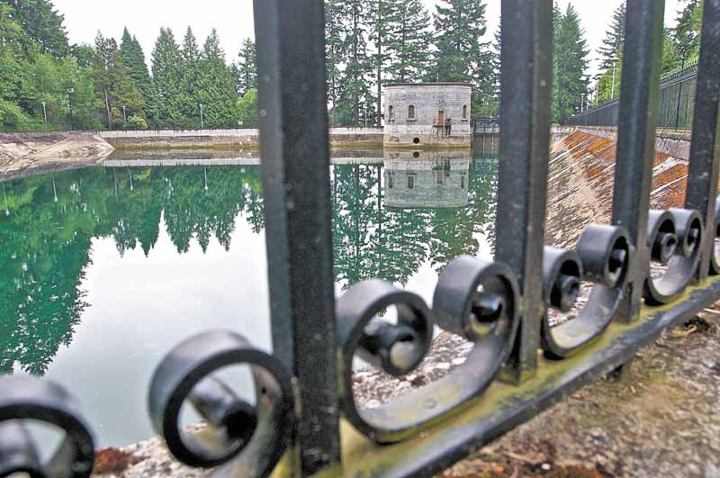 This spot at the Mt Tabor number 1 reservoir Monday June 20, 2011, is where a 21-year-old man was seen on surveillance video urinating into the reservoir in Portland, Ore.  City officials have decided to drain the reservoir at the cost of about $36,000 because of the incident.  (AP Photo/Benjamin Brink/The Oregonian)