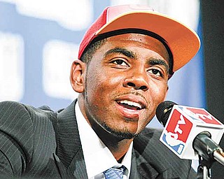 Duke's Kyrie Irving talks to reporters after being selected with the No. 1 pick by the Cleveland Cavaliers during the NBA basketball draft, Thursday, June 23, 2011, in Newark, N.J. (AP Photo/Julio Cortez)