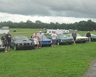 The Gear Busters car club from New Castle, Pa. poses with their cars Friday at the Steel Valley Super Nationals. Member Denny Pevan explains the club is a family that goes everywhere and does everything together. Next, they'll be at Back to the 50s in their hometown.