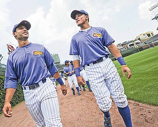 Peoria Chiefs players Greg Rohan, left, and Logan Watkins, walk around the outfield of Wrigley Field before the start of Wednesday's Midwest League game with Kane County.