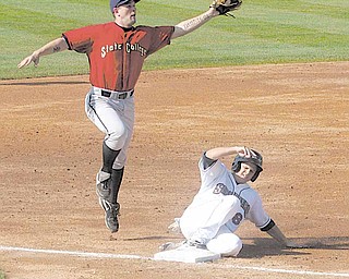  (8) Todd Hankins of the Scrappers slides into third as Wes Freeman tries to make the play Sunday afternoon in Niles.
