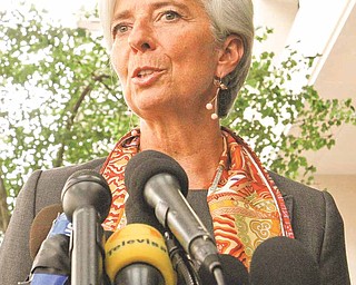 French Finance Minister Christine Lagarde speaks to the media outside the International Monetary Fund in Washington, Thursday, June 23, 2011, where she was interviewing to succeed former IMF Managing Director Dominique Strauss-Kahn. (AP Photo/Jacquelyn Martin)