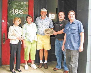 Plaque to the future: The Salem Preservation Society has placed a plaque at the Salem Coin Exchange on South Broadway Avenue. The plaque commemorates the donation of the building to the society by the late Bruce Greenamyer. The building recently was sold and is now owned by Dave and Linda Jones. Above, from left, are Jean Alice Fehr, Linda and Dave Jones, society President Craig Brown and society Vice President Keith Berger.