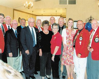 Canfield Lions Club has installed new officers. Those participating were, from left to right, front row, John Africa, Phil Bova, Joan Filisky, Caroline Phillips, Dr. Carmela Abraham, Harry Pancher and Ted Filmer, and back row, Dave Gauch, district governor-elect, installing officer; Tom Zurawick; Don Kwolek; Rich Yager; Pete Cannell; and Jack Patrick. Board members not pictured are Chris Haus, Jim Duncan and Marilyn Schmidt.