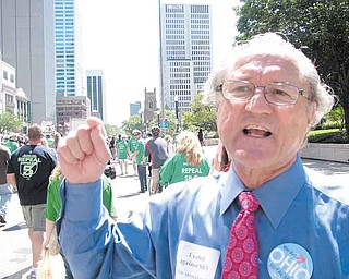 State Rep. Bob Hagan, a Democrat from Youngstown, makes a point as he marches with other opponents of Senate Bill 5 in front of the Ohio Statehouse on Wednesday. Senate Bill 5 likely will be Gov. John Kasich’s “Waterloo,” Hagan said.