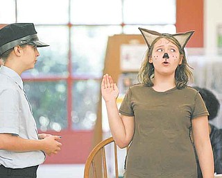 A. Wolf takes the stand during “Guilty or Not Guilty” as performed by the Youngstown Playhouse Youth Theatre at the Boardman Library on Glenwood Avenue. Wednesday’s play was part of the Public Library of Youngstown and Mahoning County’s annual summer reading program.