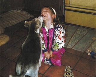 Charlie II is a mix breed (German Shepherd/Malamute) who Donna Samuels of Youngstown says they got from the pound. He is pictured playing with her niece, Marissa Gorvet, when he was 6 months old.
