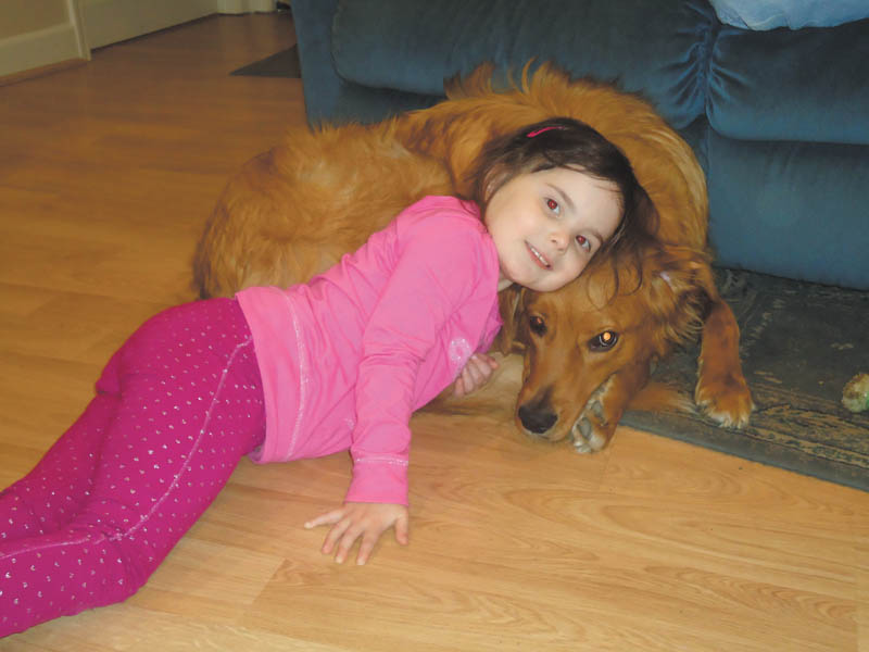 Five-year-old Carley Johnston is hanging out with her best friend, Tucker, on a rainy day in April 2011 at their home in Poland. Tucker, a 1 1/2-year-old Golden Retriever/Collie mix, was adopted by the Johnston family in Feburary 2010 from the Humane Society of Columbiana County. The photo was taken by Carley's mom, Cara Johnston.