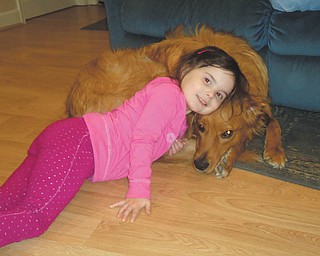 Five-year-old Carley Johnston is hanging out with her best friend, Tucker, on a rainy day in April 2011 at their home in Poland. Tucker, a 1 1/2-year-old Golden Retriever/Collie mix, was adopted by the Johnston family in Feburary 2010 from the Humane Society of Columbiana County. The photo was taken by Carley's mom, Cara Johnston.