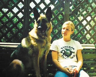 Greta was found laying on the side of the road in Cleveland, and Gary and Ann Duracky of Poland got her through German Shepherd Rescue at a shelter when she was about 1 1/2. She is now 10 years old. She loves to swing and is pictured here with their daughter Beth.