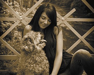 Joe Lynn of Salem caught this snapshot of Sara Sanders of Austintown and the love of her life at Mill Creek Park in June. Oreo was adopted in Cleveland 14 years ago and has been by Sara's side ever since. Sara and Oreo have shared their lifetime together, and Sara found it only fitting to include Oreo in a senior portrait.