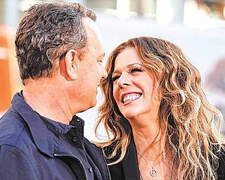 Cast members Tom Hanks, left, and Rita Wilson arrive at the premiere of "Larry Crowne" in Los Angeles, Monday, June 27, 2011. "Larry Crowne" will be released on July 1. (AP Photo/Matt Sayles)