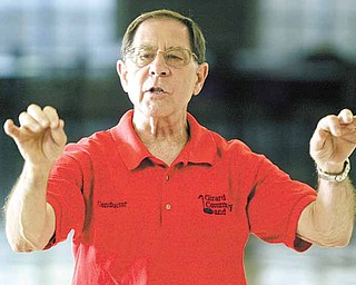 Joe Commarata, founder of Girard Community Band, gets into conductor mode during a recent rehearsal. The longtime musician, who plays the trumpet, said the community band provides a place for musicians to play for the fun of it.