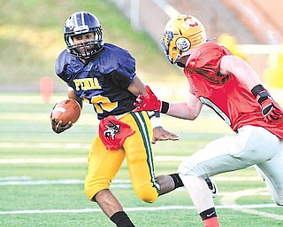 Southern cornerback Trey Griffi th tries to get the angle on Pennsylvania quarterback Jasson Adamson during Thursday’s Stateline Classic.