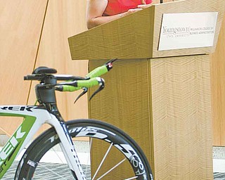 Erin Quinlan, the co-director of the upcoming Tour of the Valley, speaks at Thursday’s press conference at YSU. Pro, elite and amateur bike racers will participate in the event, which runs July 8-10.