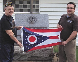 Unflagging pride: Columbiana Recorder Craig Brown, at right, presented the Glenmoor American Legion, near East Liverpool, a state of Ohio flag. Post Commander Sam Crane accepted the flag on behalf of the post. For additional information about flag donations, call Brown at 330-277-9509 or email him at browncraig77@hotmail.com.