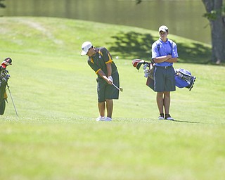ROBERT K. YOSAY | THE VINDICATOR..Cory Stefanec chips his shot on the 13th as as Matt May looks on - The area’s best youth golfers hit the links Tuesday, trying to make a name for themselves and collect the scholarship that comes along with the success.. the kickoff to the first “Greatest Junior Golfer in the Valley” tournament, and the first ball will be launched off the tees of the Diamond Back Golf Course in Canfield. Throughout the month, golfers under the age of 18 as of Aug. 31 will attempt to qualify and be named the best...-30-