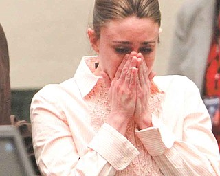 Casey Anthony reacts after the jury acquitted her of murdering her daughter, Caylee, during Anthony's murder trial at the Orange County Courthouse in Orlando, Fla., Tuesday, July 5, 2011. (AP Photo/Red Huber, Pool)