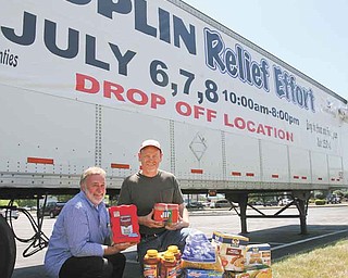 Bob Cole, left, and the Rev. Rusty Wills are coordinating Joplin Relief, a grassroots effort in the faith community to collect donations for victims of the devastating tornado in May in Joplin, Mo. Donations, like the ones shown, will be accepted today through Friday at three sites in the Mahoning Valley.