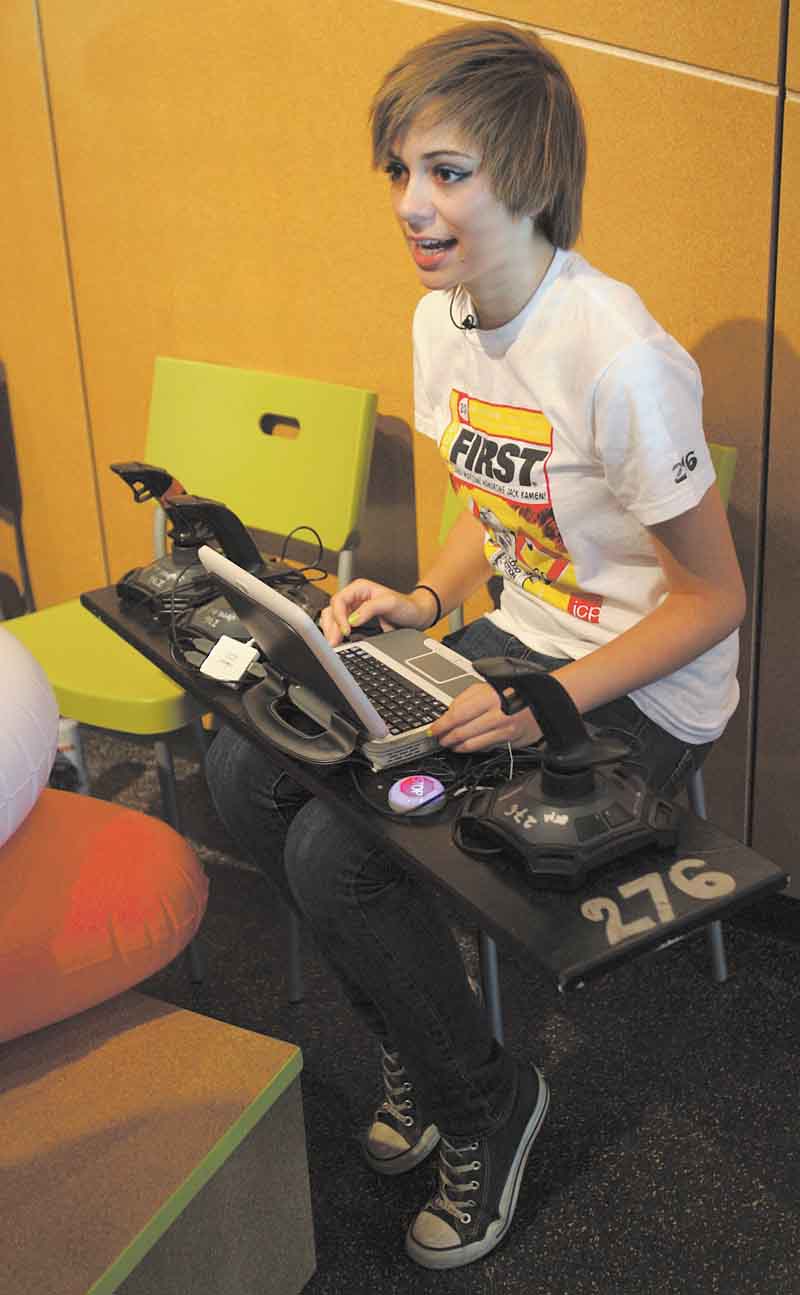 Hallie Duarte, an incoming sophomore at Youngstown Early College, is at the controls of the robot of her team, the 276 Mad Cows, consisting of Youngstown high-school students.