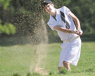 Brandon Pluchinsky, 17, works his way out of a sand trap on the No. 10 hole of Diamond Back Golf Course in Canfi eld on Tuesday during the fi rst qualifying round for the inaugural Greatest Junior Golfer of the Valley golf tournament. Eight golfers — four boys and four girls — made the cut to advance to the championship round, which will be played July 31 at Trumbull Country Club. Pluchinsky, a student at South Range High School, led the boys with a two-over 74.