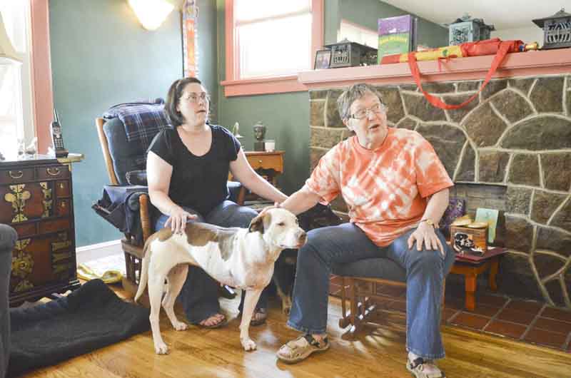 North Side neighbors Gretchen Brown, left, and L.J. 'Tess' Tessier are part of a group who rescued Billie Jean, a year-old mixed-breed stray. Billie Jean, who’d been shot and had to have a leg amputated, is ready for a permanent home.