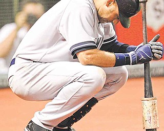 New York Yankees' Derek Jeter waits to bat in the ninth inning in a baseball game against the Cleveland Indians, Wednesday, July 6, 2011, in Cleveland. Jeter did not get a chance to bat in the ninth. Jeter ended the game three away from 3,000 for his career. The Indians won 5-3. (AP Photo/Tony Dejak)