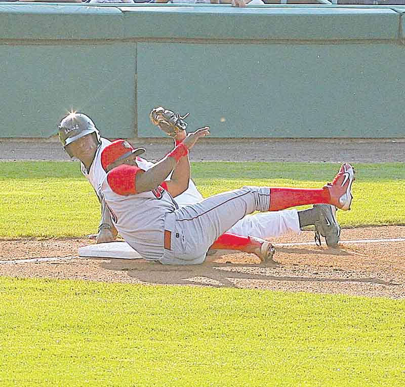 SCRAPPERS - (27) Bryson Myles is out at third as Maikel Franco makes the play from the ground during thier game Wednesday night in Niles. - Special to The Vindicator/Nick Mays