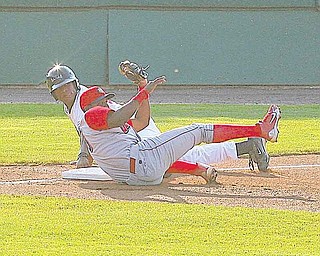 SCRAPPERS - (27) Bryson Myles is out at third as Maikel Franco makes the play from the ground during thier game Wednesday night in Niles. - Special to The Vindicator/Nick Mays