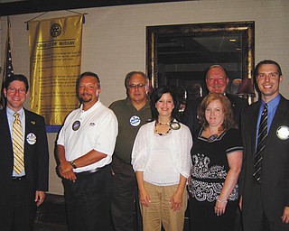 Perfect attendance: At its June 27 meeting, the Rotary Club of Austintown handed out perfect attendance awards for the second quarter. Those receiving awards were, from left to right, Dr. Mitchell Dalvin, Mark Cole, Jerry Haber, Deanna Spirko, Susan Leetch, Brian Laraway and Chuck Baker (in back).