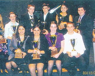 A remarkable year! More than 100 trophies were awarded to area piano, violin and vocal students at the Ohio Federation of Music Clubs District IB Festival recently. One 90-point cup, three 75-point cups and eight 60-point cups were given at the awards ceremony after the honors recital that day. In the front row, from left to right, are Amanda Ellis and Nicole Noday, 75-point cups, DiDomenico Studio; and Eva Laino, 90-point cup, and Jared Laino, 75-point cup, Rhinehart Studio. In the back row are 60-point cup recipients Lindsay Olsen, Hayley Ward and Michael Pallotta, DiDomenico Studio; Josiah Keener, Treble Clef Club; Arianna Ellis, DiDomenico Studio; Stephen DiPaolo, Rhinehart Studio; and Aylin Sarac, DiDomenico. Absent from the photo is Marie Adams, 60-point cup, DiDomenico.
