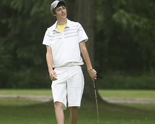 ROBERT K. YOSAY | THE VINDICATOR..Using his foot to push his ball as it goes towards the whole is Brandon Pluchinsky from South Range- The Second Round of qualifiers for the Best Jr. Golfer was held at Tamer Win in Cortland on Friday morning - .. ...-30-