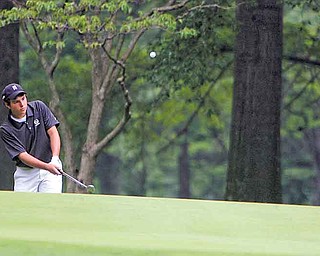 ROBERT K. YOSAY | THE VINDICATOR..winning chipper - Dominic Patella chips as Adam Bouch looks on.. - 16th hole - The Second Round of qualifiers for the Best Jr. Golfer was held at Tamer Win in Cortland on Friday morning - .. ...-30-