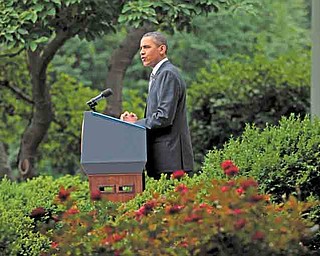 President Barack Obama delivers a statement on the monthly jobs report Friday in the Rose Garden of the White House in Washington.