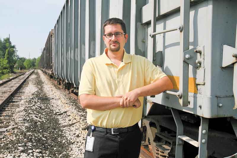 Boardman Township Administrator Jason Loree assesses the amount of trash along the former Youngstown & Southern rail line in the township.