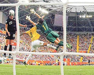 United States' Abby Wambach scores her side's 2nd goal during the quarterfinal match between Brazil and the United States at the Women’s Soccer World Cup in Dresden, Germany, Sunday, July 10, 2011. (AP Photo/Marcio Jose Sanchez)