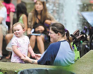 RAMI DAUD | THE VINDICATOR.Rachel Watts plays with her daughter Brynn Luce at the YSU ArtistsÕ Marketplace outside of the Kilcawley Center Saturday afternoon.
