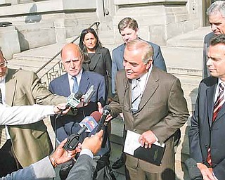 Anthony M Cafaro Sr., center, and his attorney Martin G. Weinberg, left, meet with the press outside the Mahoning County Courthouse soon after all charges were dismissed.