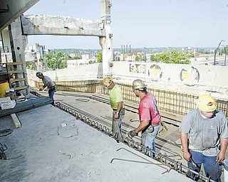 William D Lewis The Vindicator Work continues on the .YSU parking deck. Plans are for the renovation of the 1971 structure to be finished in time for Fall semester opening Aug 29.