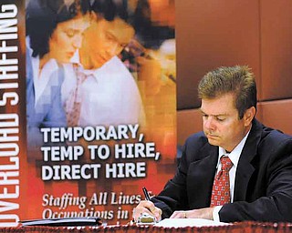 Unemployed electrical engineer William Love of Pasadena, Md., whose unemployment benefi ts have
been exhausted, fi lls out an application for a sales position at a job fair in Linthicum, Md. The number of
job postings didn’t increase in May, a sign that hiring is unlikely to pick up this summer.