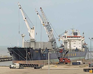 In this May 19, 2011 photo, steel coils are unloaded from the Polish ship "Isa" at the Port of Cleveland. The Commerce Department said Tuesday, July 12, 2011, the deficit increased 15.1 percent to $50.2 billion in May. That's the largest imbalance since October 2008. (AP Photo/Mark Duncan)