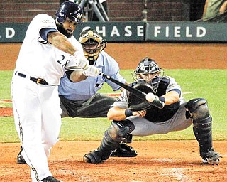 National League's Prince Fielder of the Milwaukee Brewers hits a three-run home run during the fourht inning of the MLB All-Star baseball game Tuesday, July 12, 2011, in Phoenix. (AP Photo/Ross D. Franklin)
