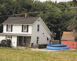 A temporary swimming pool sits in a driveway at a home in the 1200 block of Campbell Street in Youngstown.