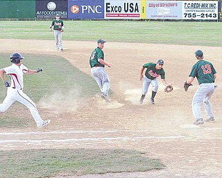 Rondinelli second baseman Anthony Rohan fi elds the ball to fi rst baseman Todd Timmick (13) to get Anthony Ciocca out during the Connie Mack state baseball tournament Wednesday at Cene Park in Struthers. Rondinelli lost to the Vipers, 4-2, and were eliminated from competition.