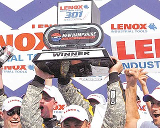 NASCAR driver Ryan Newman celebrates after winning the Lenox Industrial Tools 301 on Sunday at New Hampshire Motor Speedway.