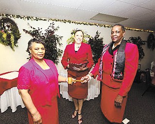 From left to right are Gwen Montgomery, Germaine Bennett and Marcia Haire-Ellis, members of the Youngstown Alumnae Chapter of Delta Sigma Theta Sorority. Montgomery is the new president, Bennett conducted her installation recently, and Haire-Ellis is outgoing president.