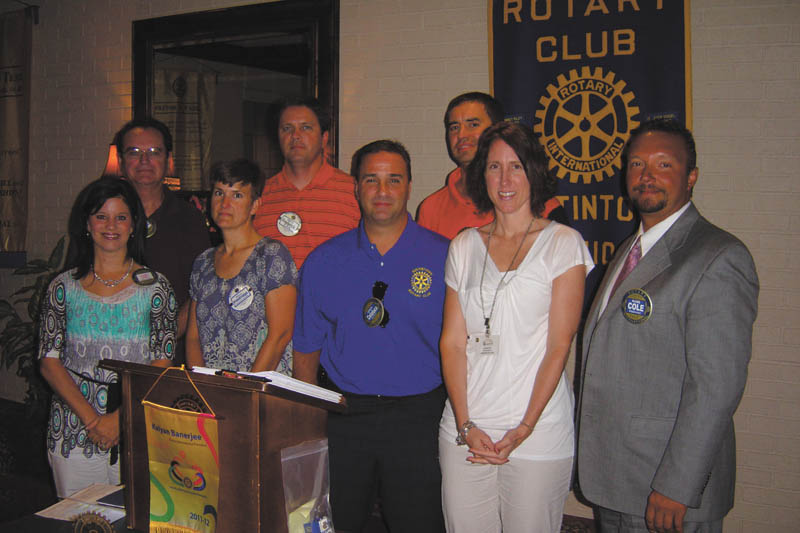 Sworn to serve: Newly elected officers and the board of directors of the Rotary Club of Austintown were sworn in by Rotarian Chuck Baker at the July 11 meeting. In the front row, from left to right, are Deanna Spirko, president; Hillary Prestridge, secretary; Vince Colaluca, vocational service; Jennifer Connolly, international; and Mark Cole, club service. In the back row are Ron Carroll, vice president; Brian Frederick, treasurer; and Dave Buttar, community service.