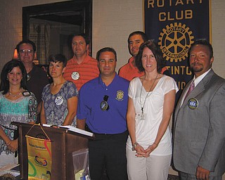 Sworn to serve: Newly elected officers and the board of directors of the Rotary Club of Austintown were sworn in by Rotarian Chuck Baker at the July 11 meeting. In the front row, from left to right, are Deanna Spirko, president; Hillary Prestridge, secretary; Vince Colaluca, vocational service; Jennifer Connolly, international; and Mark Cole, club service. In the back row are Ron Carroll, vice president; Brian Frederick, treasurer; and Dave Buttar, community service.