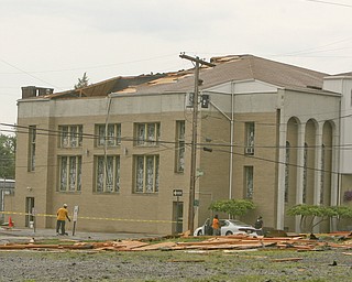 ROBERT K. YOSAY | THE VINDICATOR..- Mt Calvary Church on Oak Hill suffered severe damage as the roof was ripped off and landed across Oak Hill in a vacant lot - firefighters did not think anyone was injured - A late afternoon summer thunderstorm hit the southside of Youngstown - taking down limbs, trees and knocking out electric - the RIBFEST at the Covelli Centre had several people injured when tents were blown down ...-30-